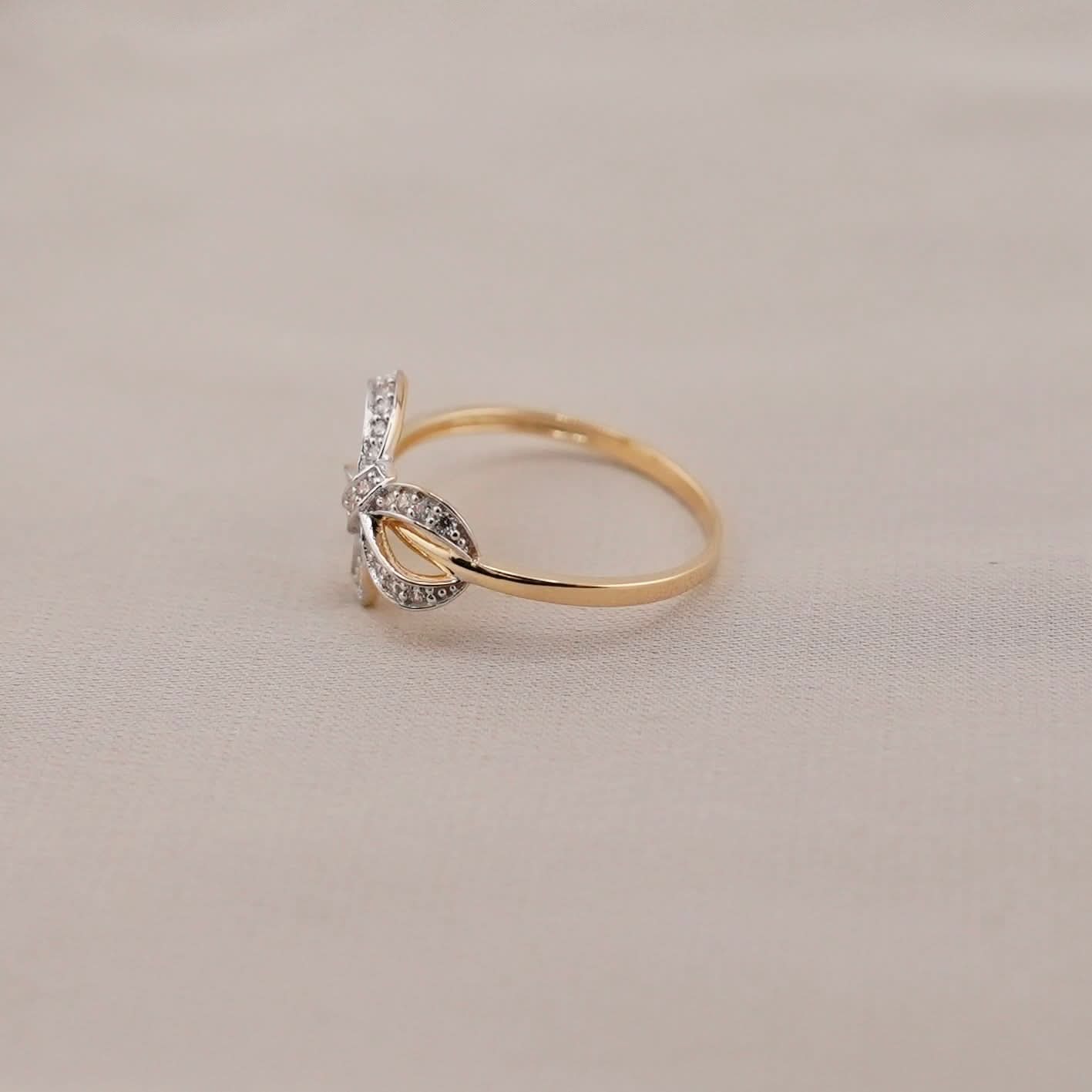 14k Gold Bow Ring . 072